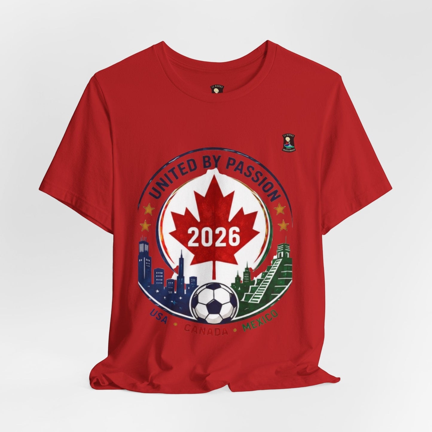 Red 100% cotton CJ Riders Foundation Store t-shirt with "United by Passion 2026" graphic featuring Canadian maple leaf, soccer ball, and city skylines.