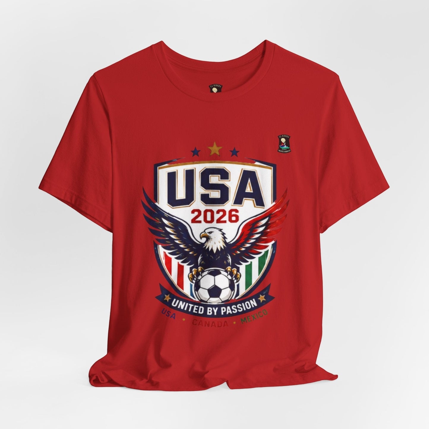 CJ Riders Foundation Store red 100% cotton t-shirt with USA 2026 soccer graphic featuring an eagle and soccer ball.