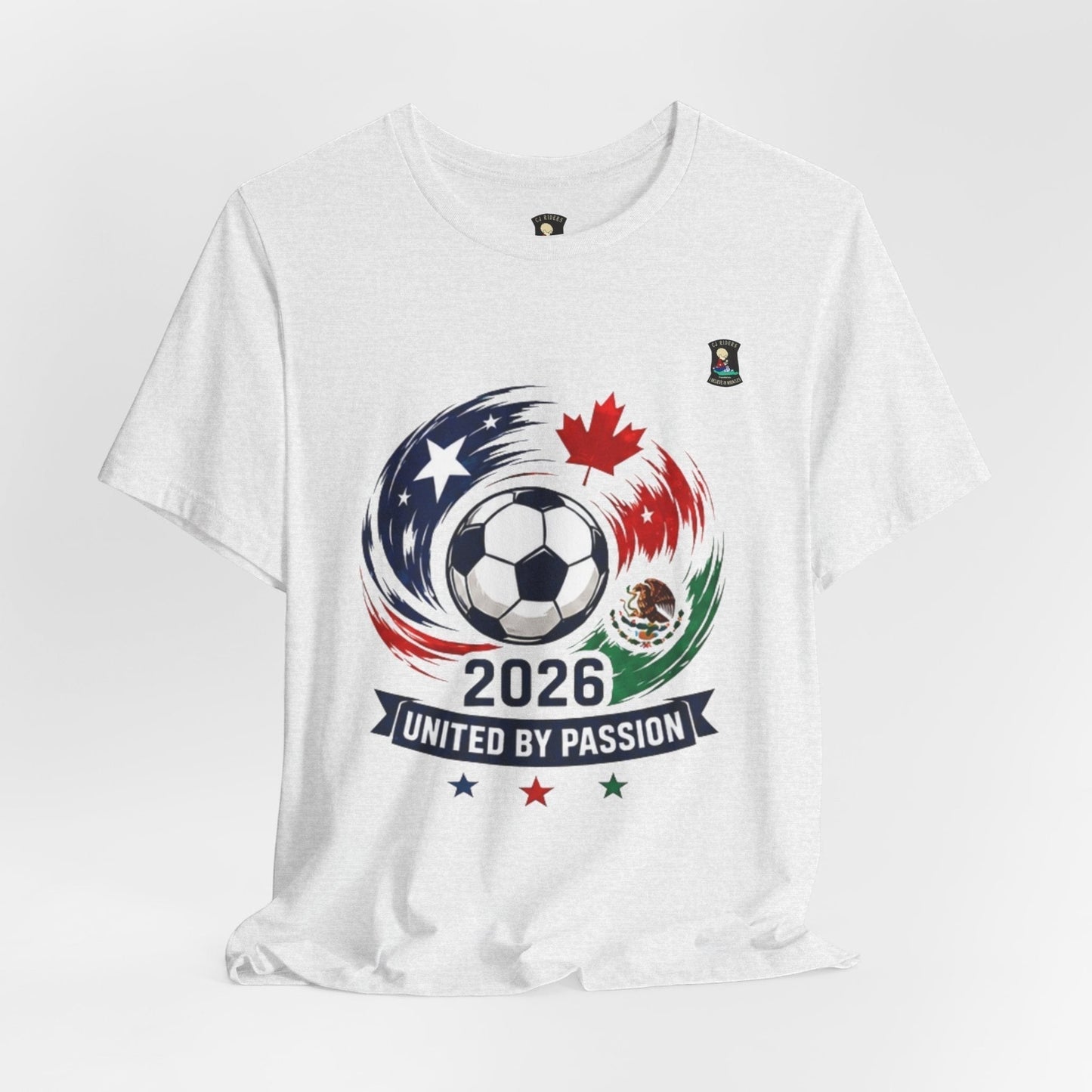 CJ Riders Foundation Store white 100% cotton t-shirt with 2026 soccer graphic featuring a ball, USA, Canada, Mexico flags and "United by Passion" text.
