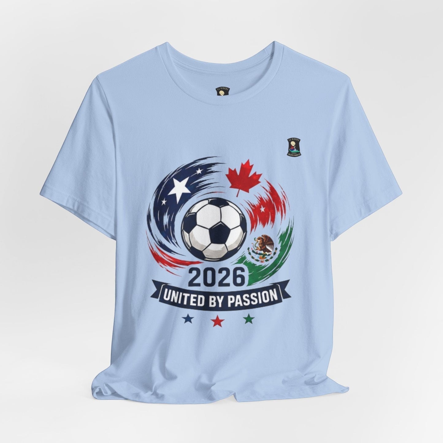 Light blue 100% cotton t-shirt with a soccer ball, USA, Canada, and Mexico flags, and '2026 United by Passion' text.