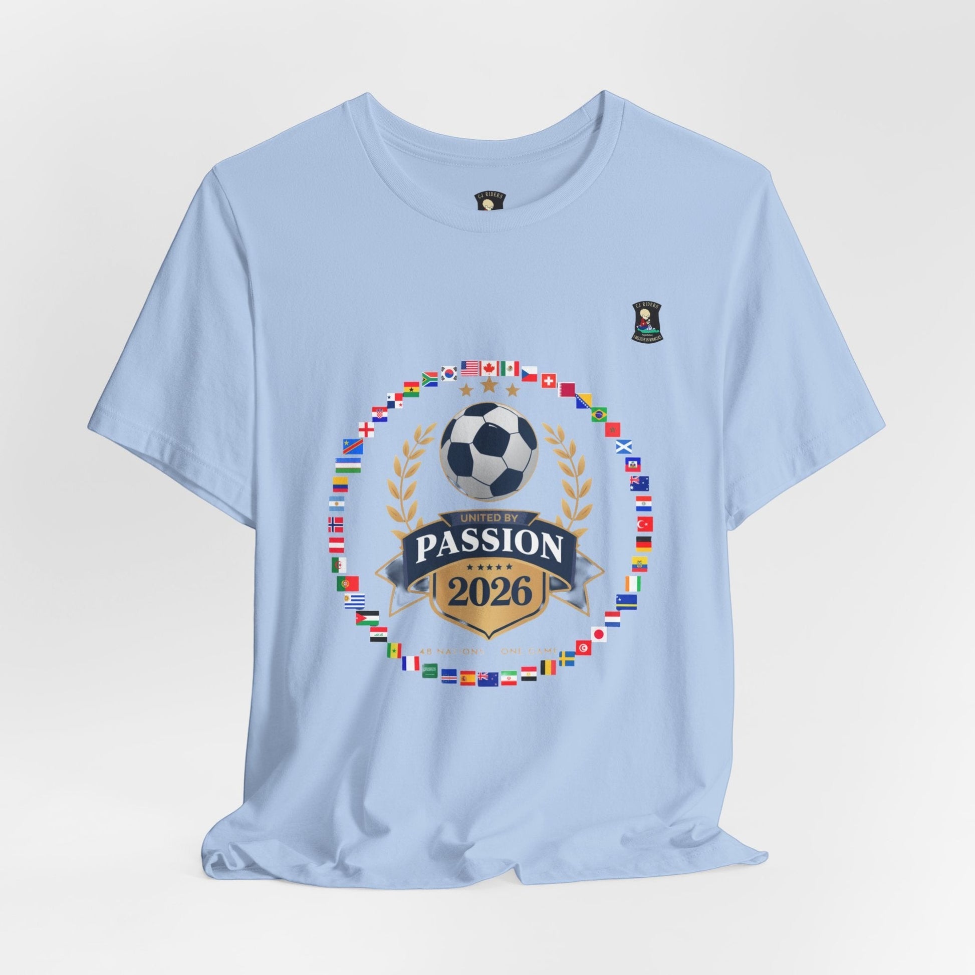 CJ Riders Foundation Store light blue 100% cotton t-shirt with a soccer badge design for the 2026 World Cup.