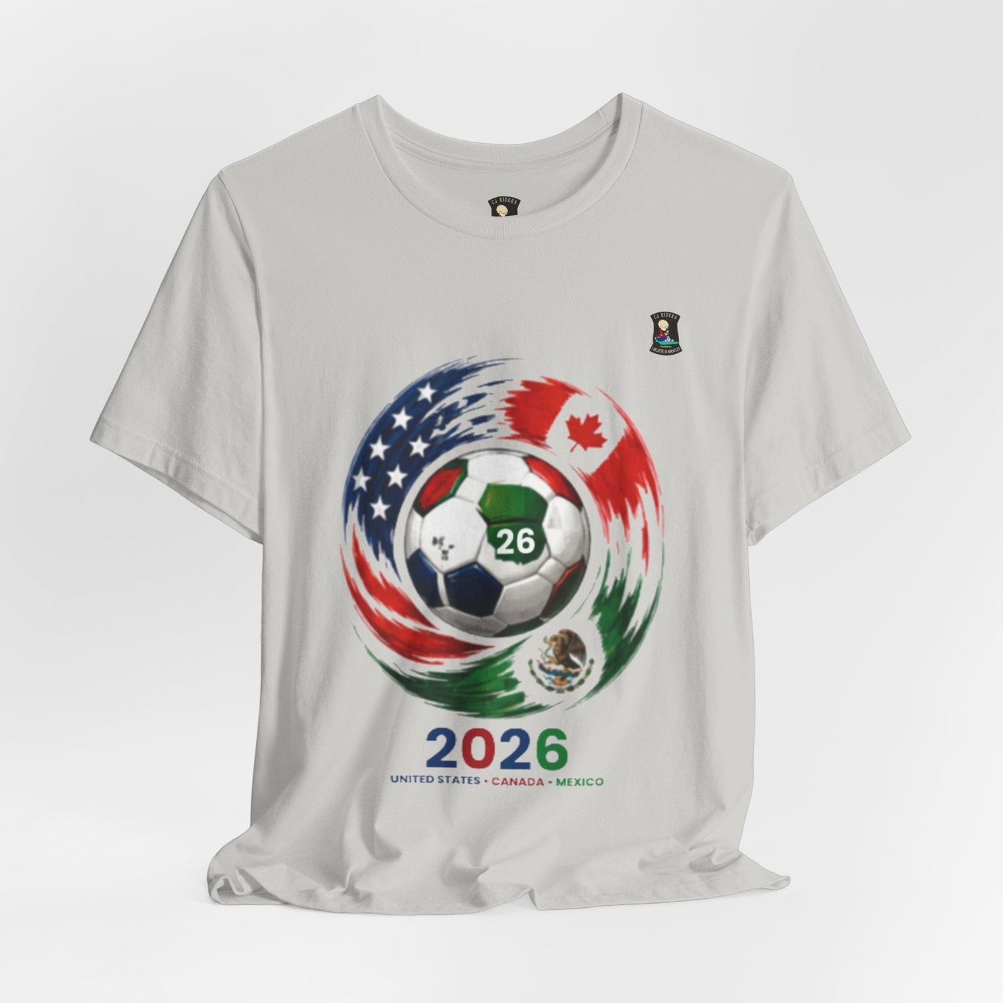 CJ Riders Foundation Store light grey 100% cotton t-shirt with 2026 Soccer graphic featuring a ball with US, Canada, Mexico flags.