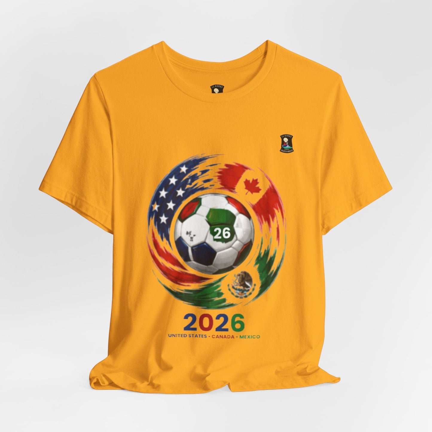 CJ Riders Foundation Store yellow 100% cotton t-shirt with 2026 soccer graphic featuring USA, Canada, Mexico flags and a soccer ball.