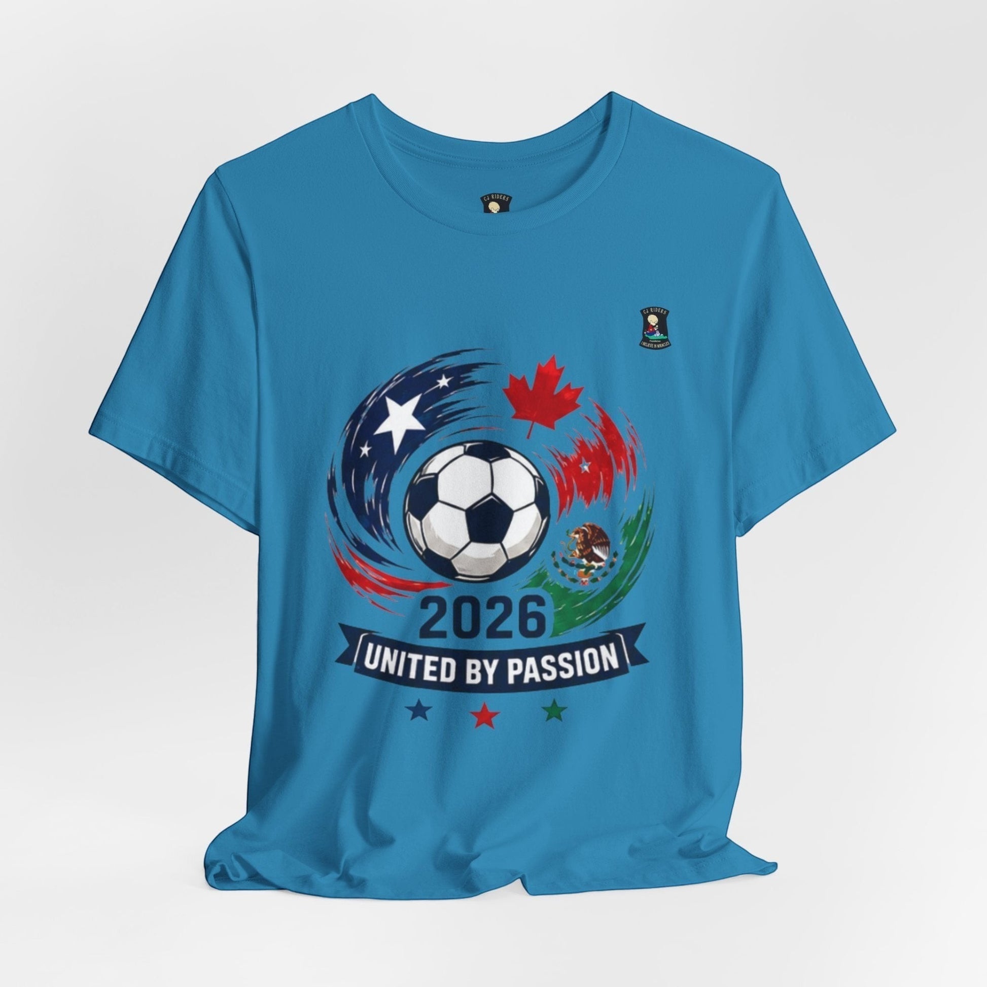 CJ Riders Foundation Store blue 100% cotton soccer t-shirt with 2026 "United by Passion" graphic featuring a soccer ball, USA, Canada, and Mexico.