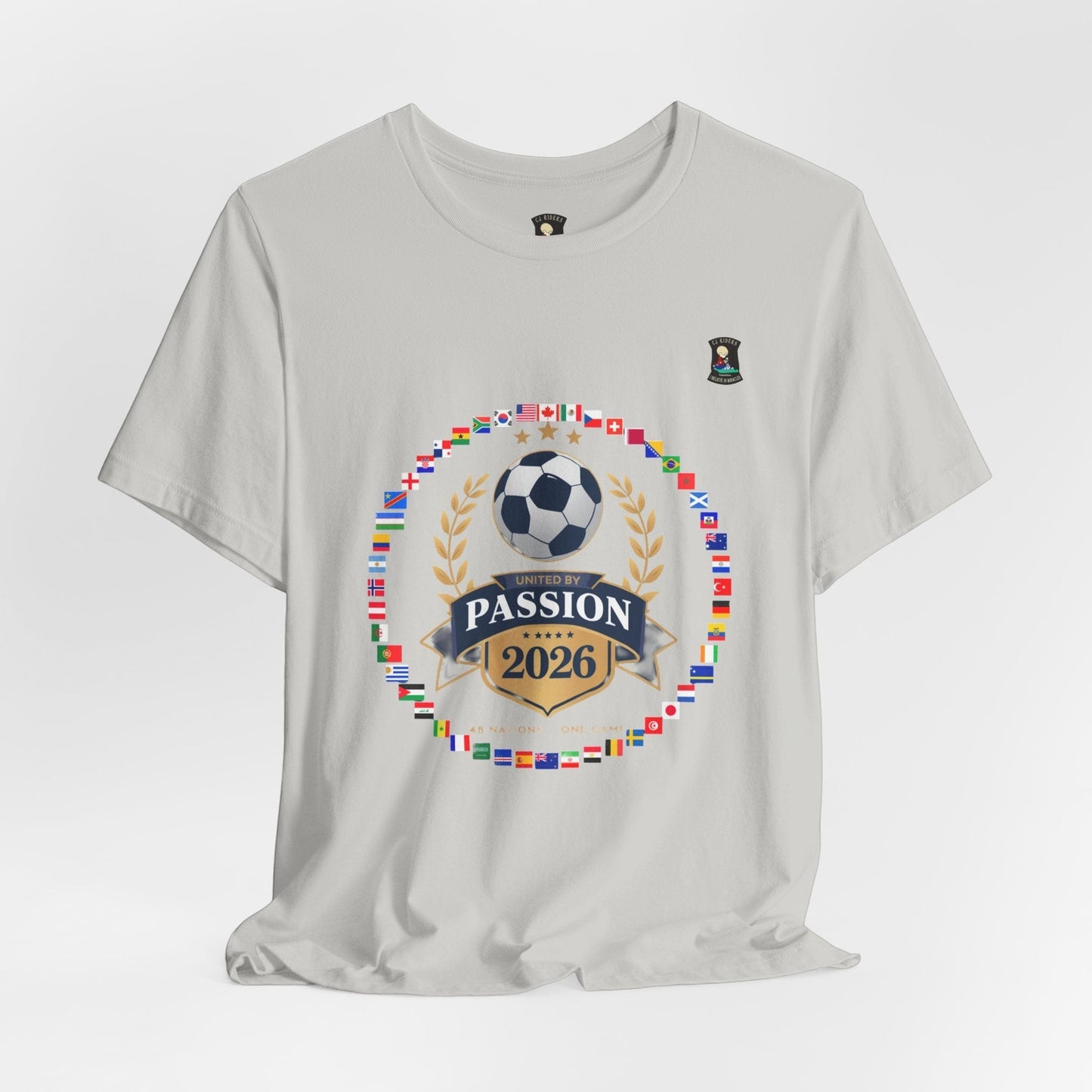 CJ Riders Foundation Store light grey 100% cotton t-shirt with a soccer badge design for the 2026 World Cup.