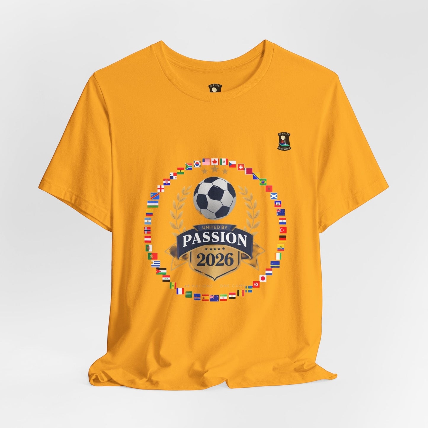 CJ Riders Foundation Store yellow 100% cotton t-shirt with 2026 World Cup graphic featuring a soccer ball, flags, and "United by Passion" text.