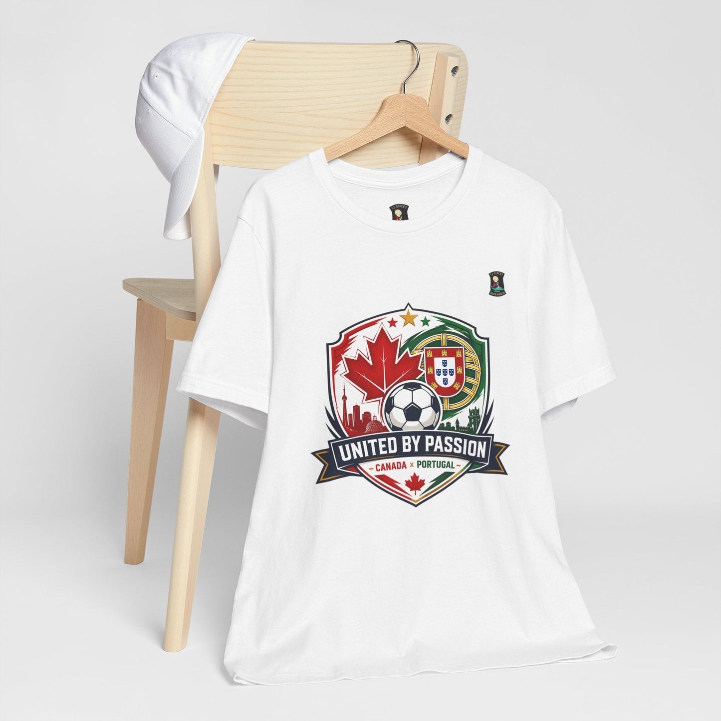 CJ Riders Foundation Store white 100% cotton t-shirt with Canada & Portugal soccer badge graphic. Features "United by Passion" text.