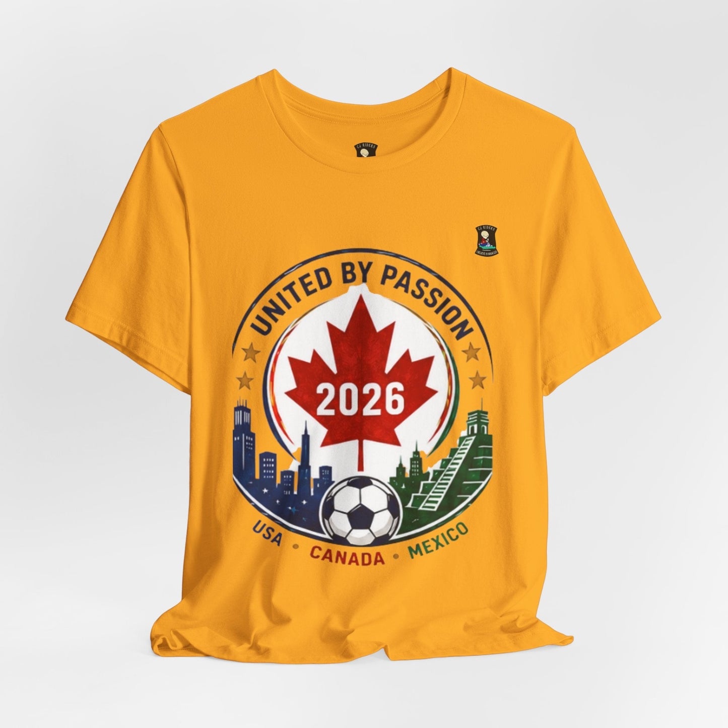 CJ Riders Foundation Store yellow cotton t-shirt with "United by Passion 2026" soccer crest design featuring Canadian maple leaf, soccer ball, and city skylines.