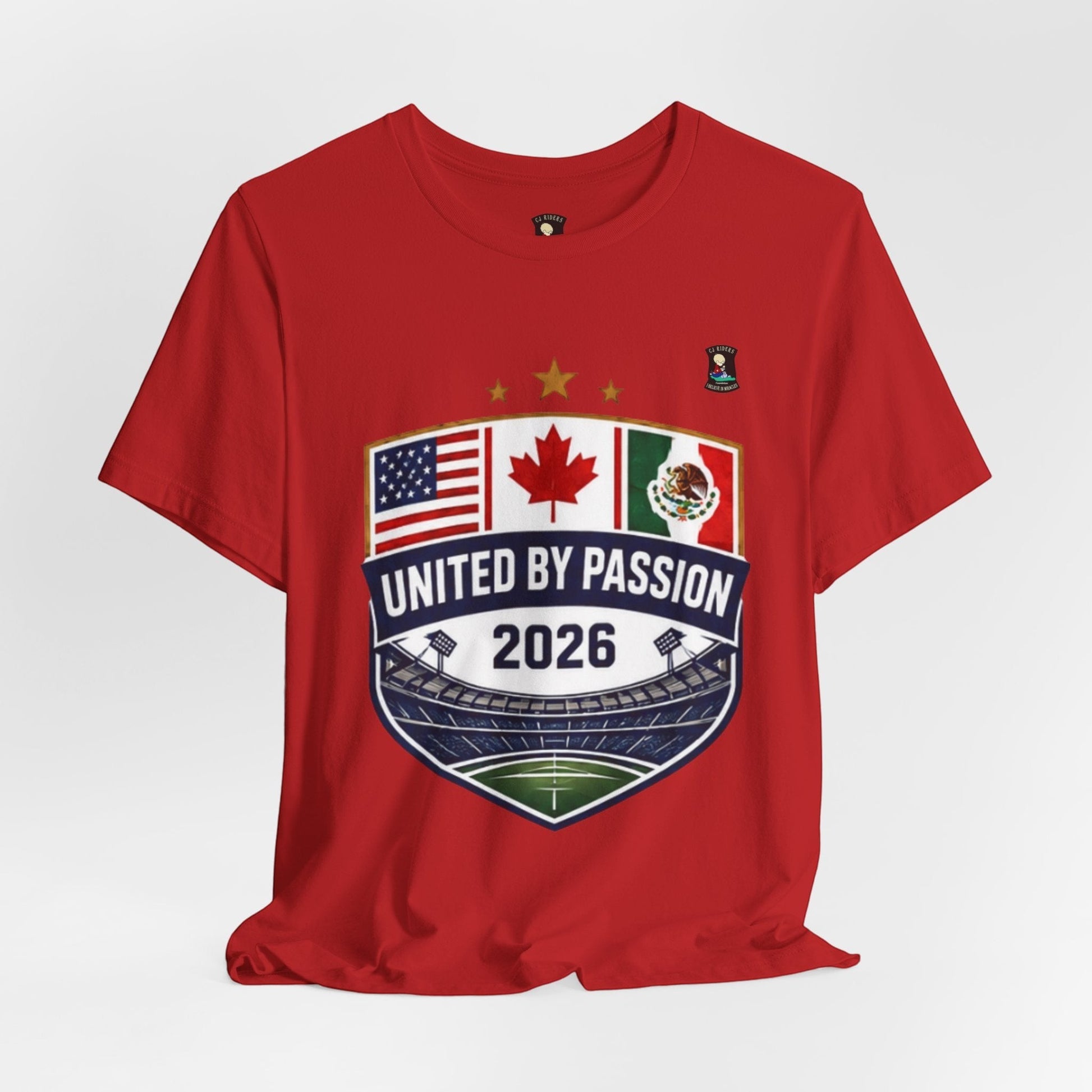 CJ Riders Foundation Store red 100% cotton t-shirt with United by Passion 2026 shield graphic featuring USA, Canada, and Mexico flags.