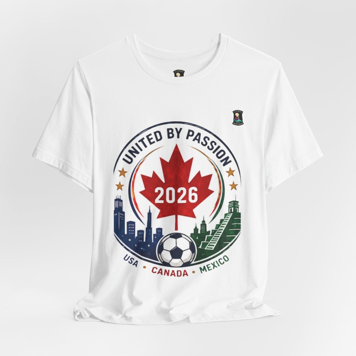 CJ Riders Foundation Store white cotton t-shirt with United by Passion 2026 soccer crest design featuring Canadian maple leaf, soccer ball, and city skylines.