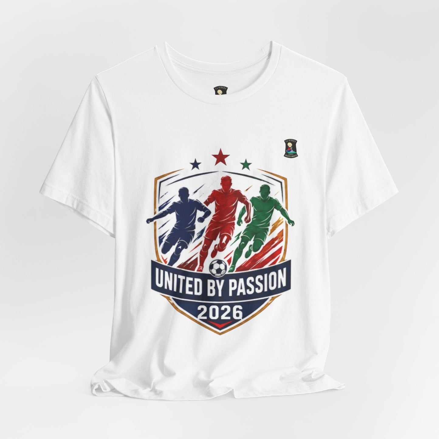 CJ Riders Foundation Store white 100% cotton t-shirt with "United by Passion 2026" soccer graphic featuring 3 colorful player silhouettes.