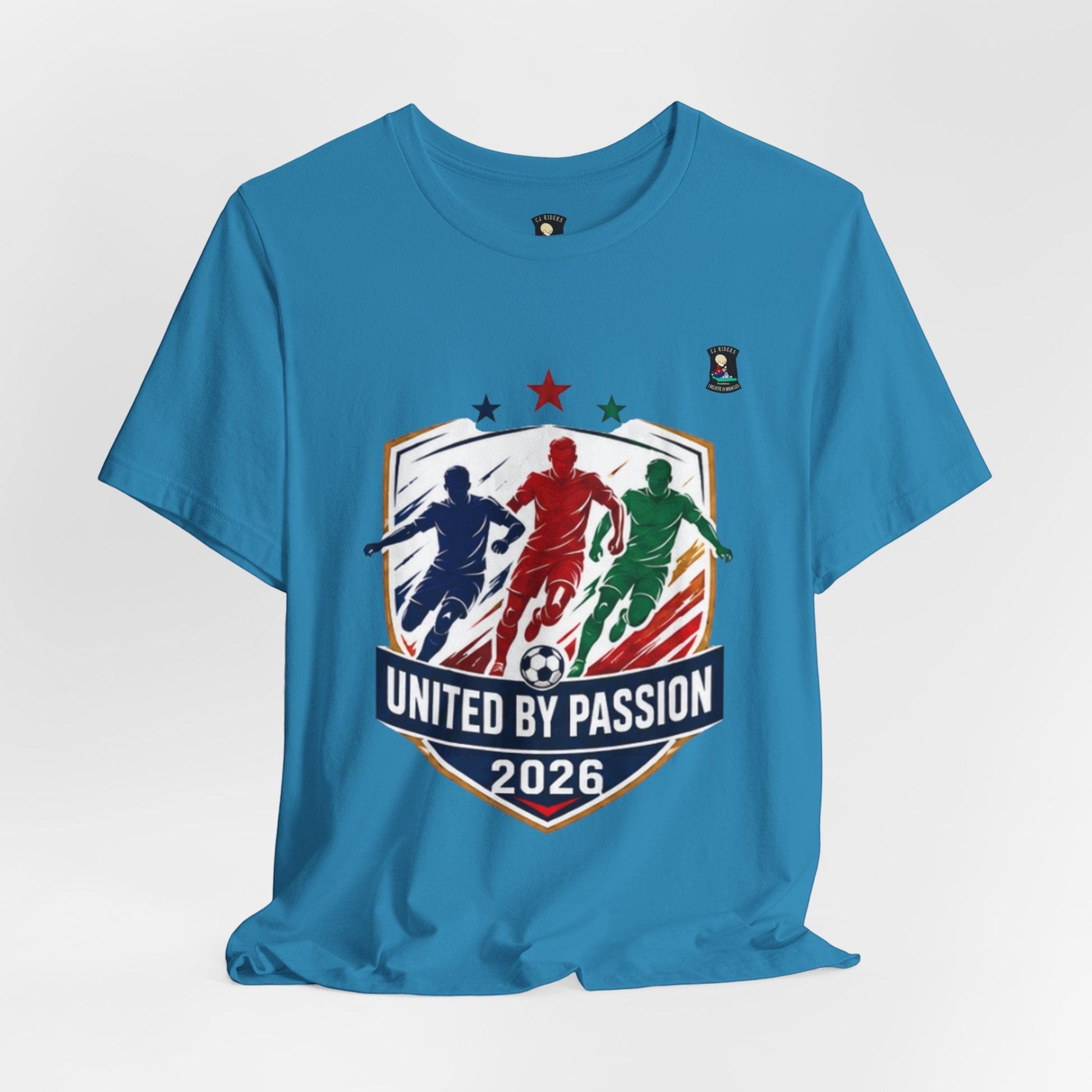 CJ Riders Foundation Store blue 100% cotton t-shirt with "United by Passion 2026" soccer graphic featuring 3 players.