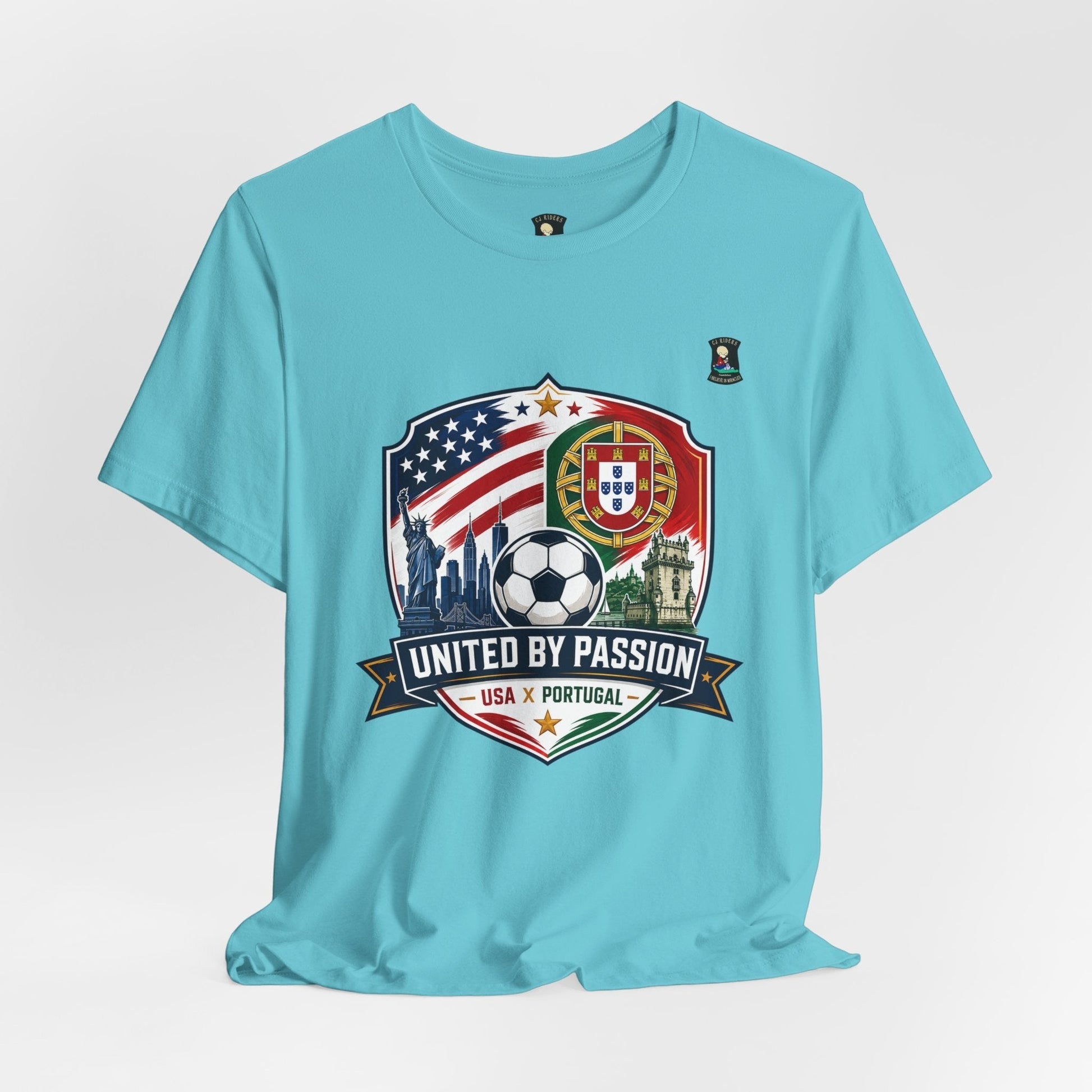 CJ Riders Foundation Store light blue 100% cotton t-shirt with USA & Portugal soccer badge graphic and "United by Passion" text.