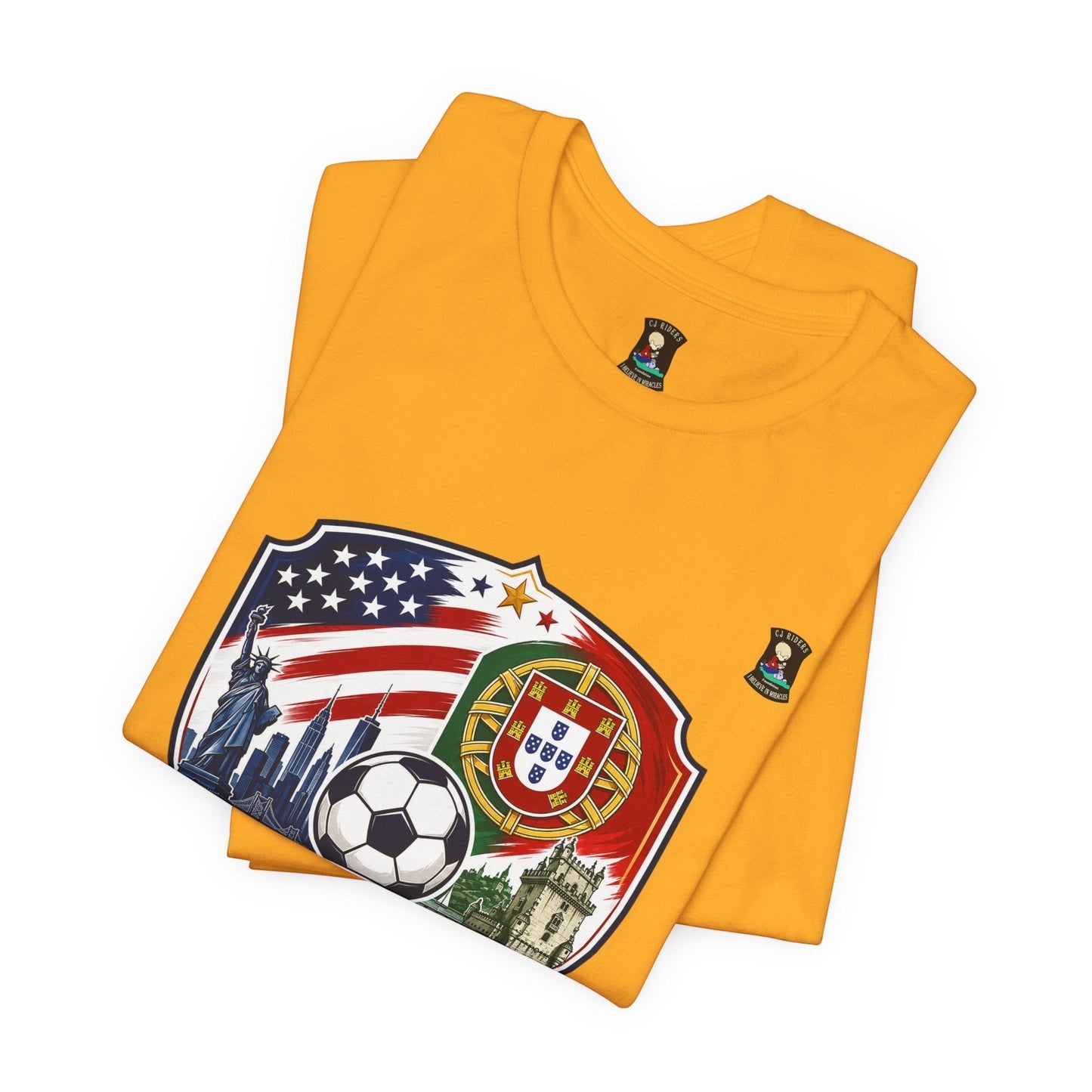 CJ Riders Foundation Store yellow cotton t-shirt with USA & Portugal soccer badge design, Statue of Liberty, NYC skyline, soccer ball, and Portuguese crest.