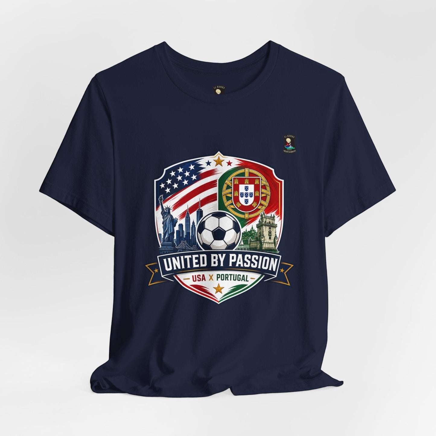 CJ Riders Foundation Store navy blue 100% cotton t-shirt with USA & Portugal soccer crest, Statue of Liberty, and "United by Passion" text.