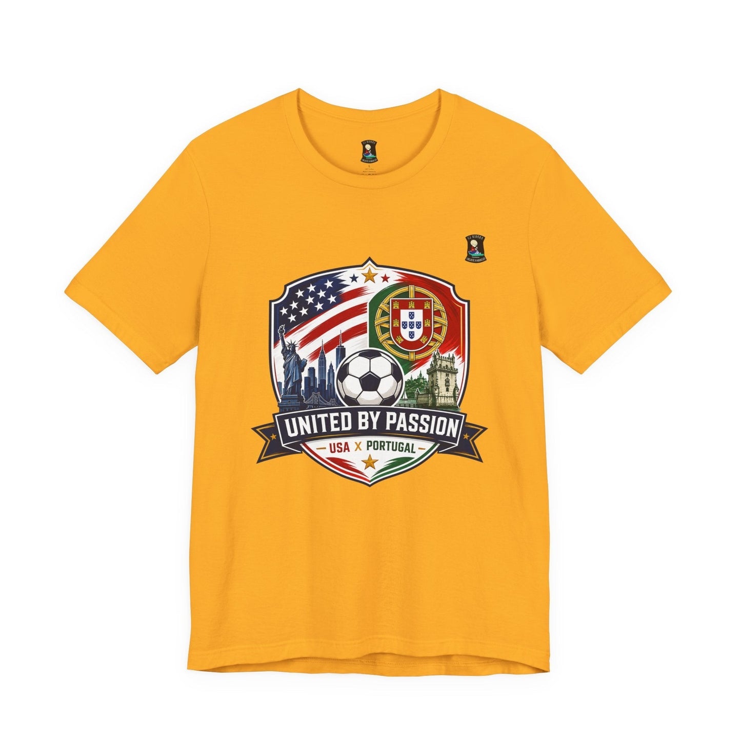 CJ Riders Foundation Store yellow cotton t-shirt with USA & Portugal soccer badge, Statue of Liberty, and skyline graphic.