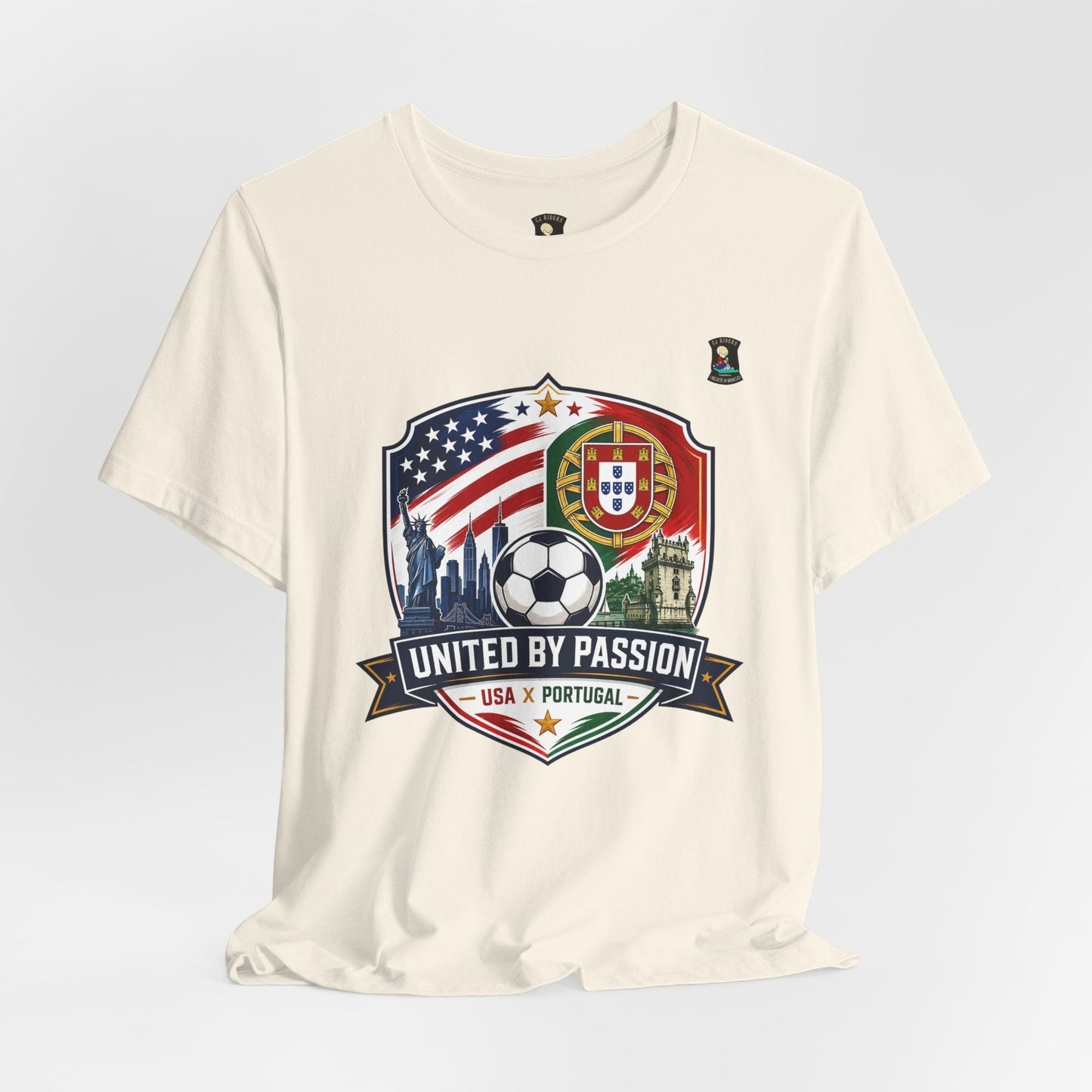 CJ Riders Foundation Store cream 100% cotton soccer t-shirt with USA & Portugal United by Passion 2026 graphic.