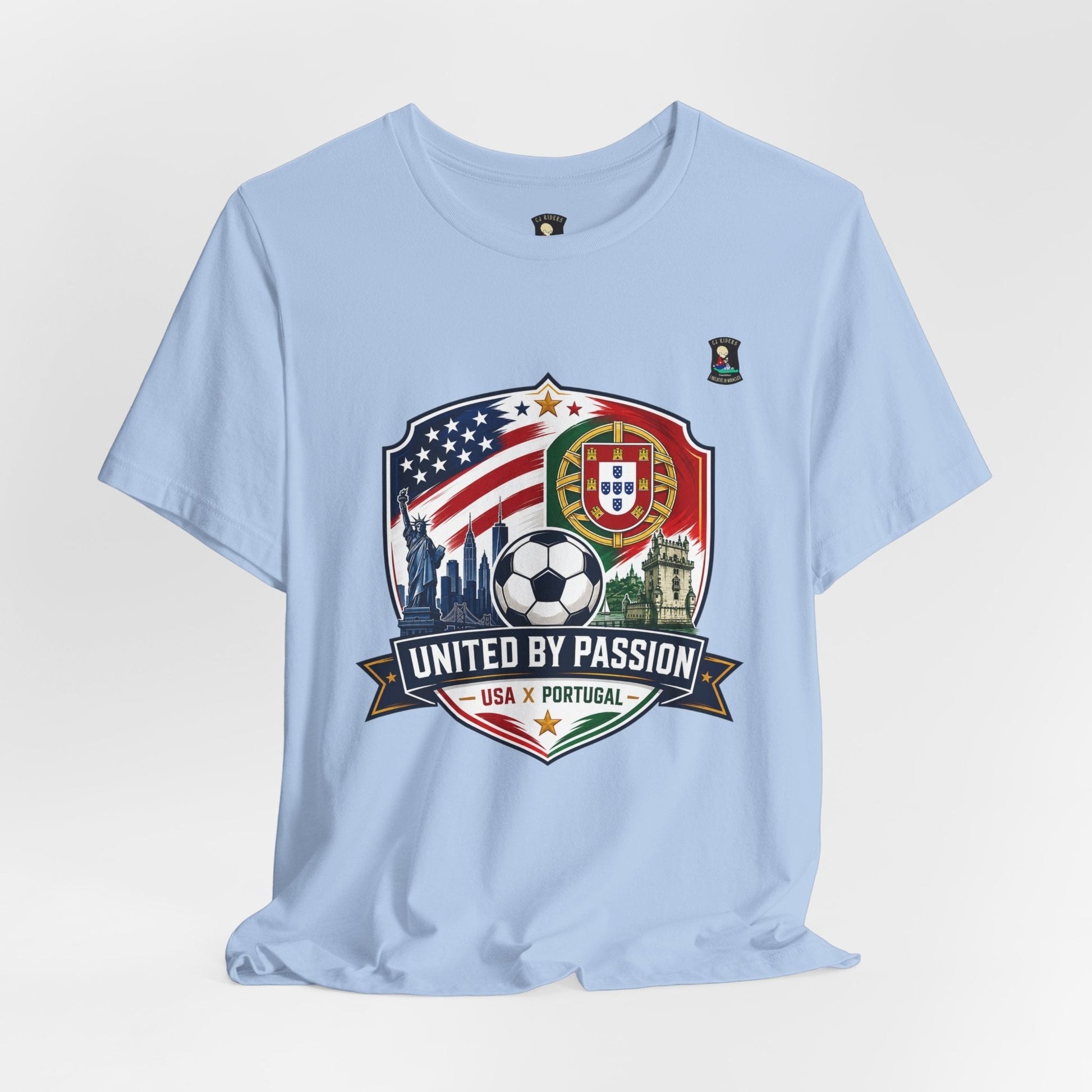 CJ Riders Foundation Store light blue 100% cotton soccer t-shirt with USA & Portugal United by Passion 2026 graphic.