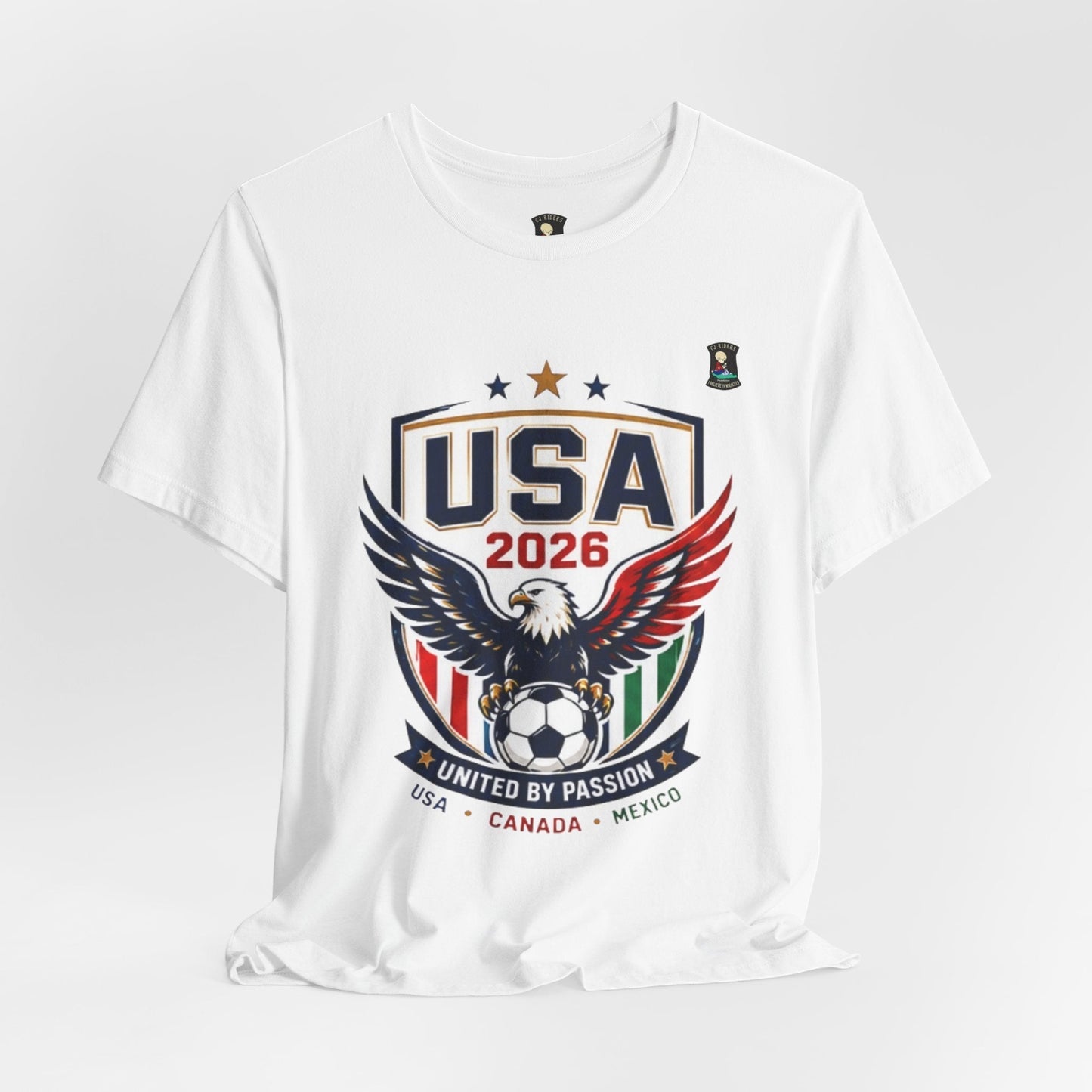 CJ Riders Foundation Store white 100% cotton USA United by Passion 2026 soccer t-shirt with eagle graphic and patriotic colors.