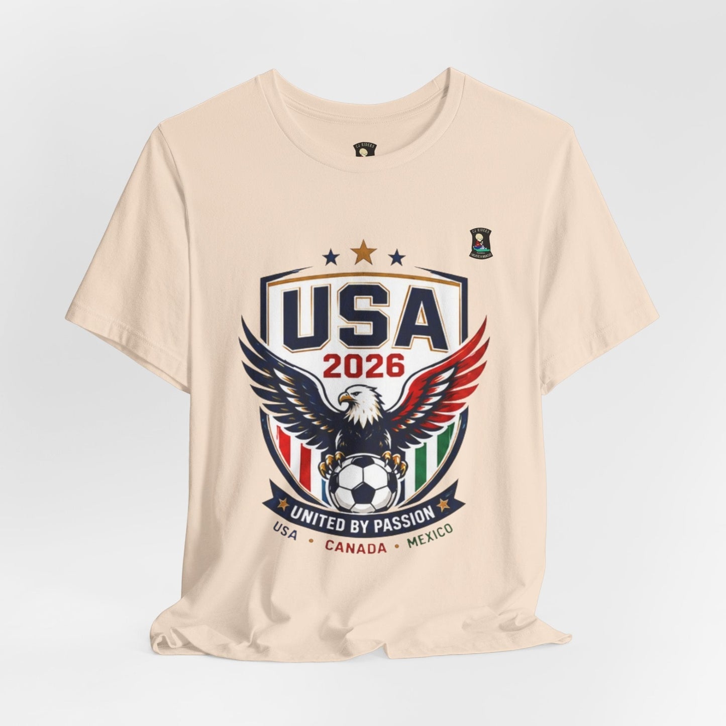 CJ Riders Foundation Store USA United by Passion 2026 soccer t-shirt with eagle graphic and USA, Canada, Mexico accents.